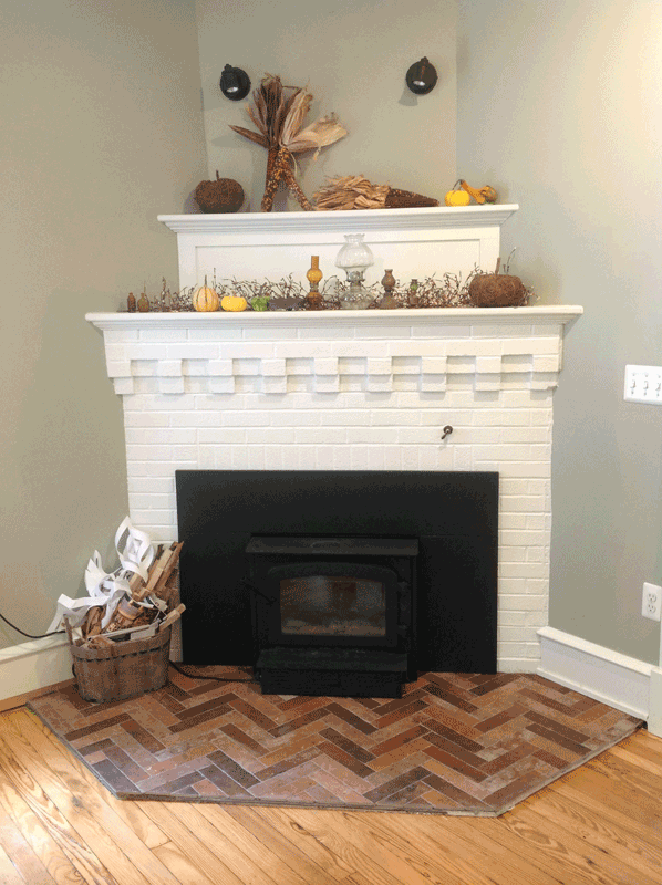 Fireplace with new hearth and white painted brick